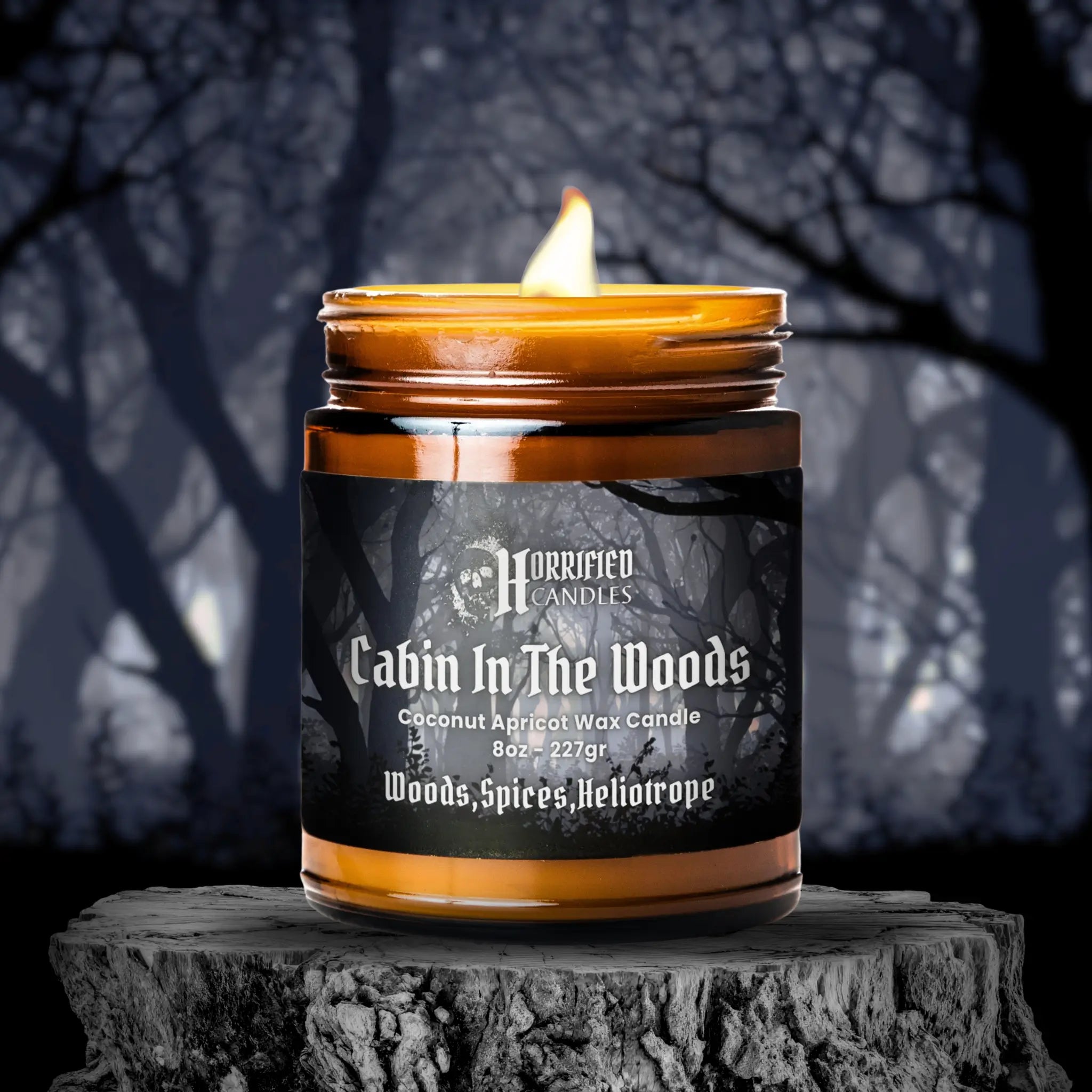 Candle labeled 'Cabin In The Woods' by Horrified Candles on a dark background