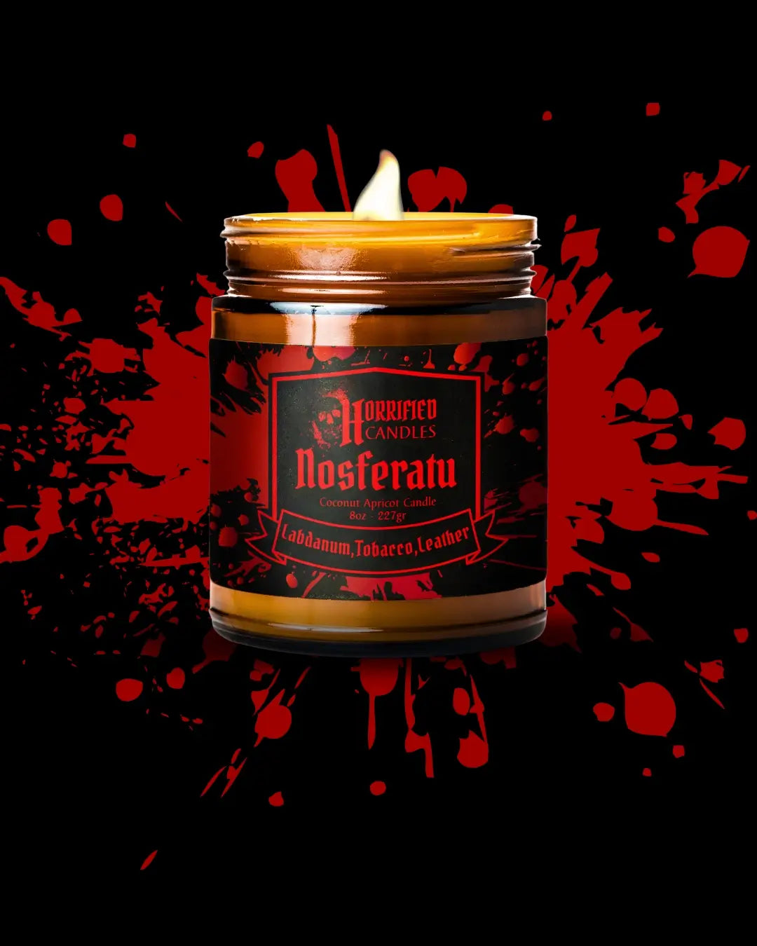 Candle in a jar labeled 'Nosferatu' with a dark background and red accents.