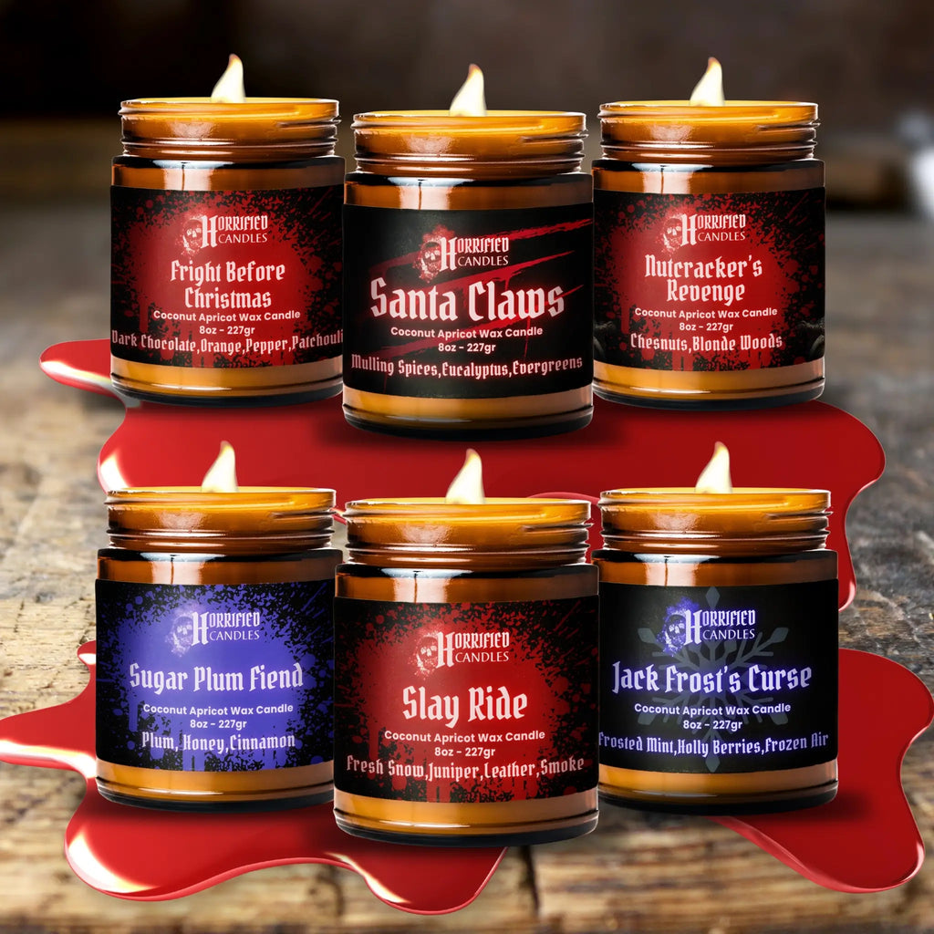 Set of candles with labeled names on a wooden surface