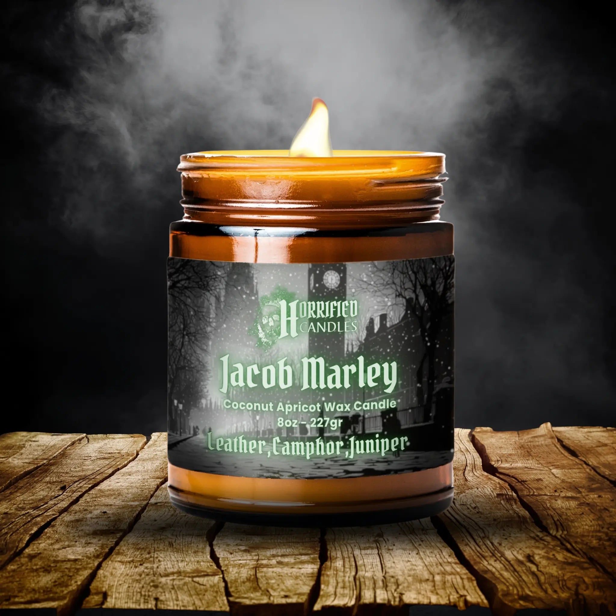 Candle labeled 'Jacob Marley' on a wooden surface with a dark background