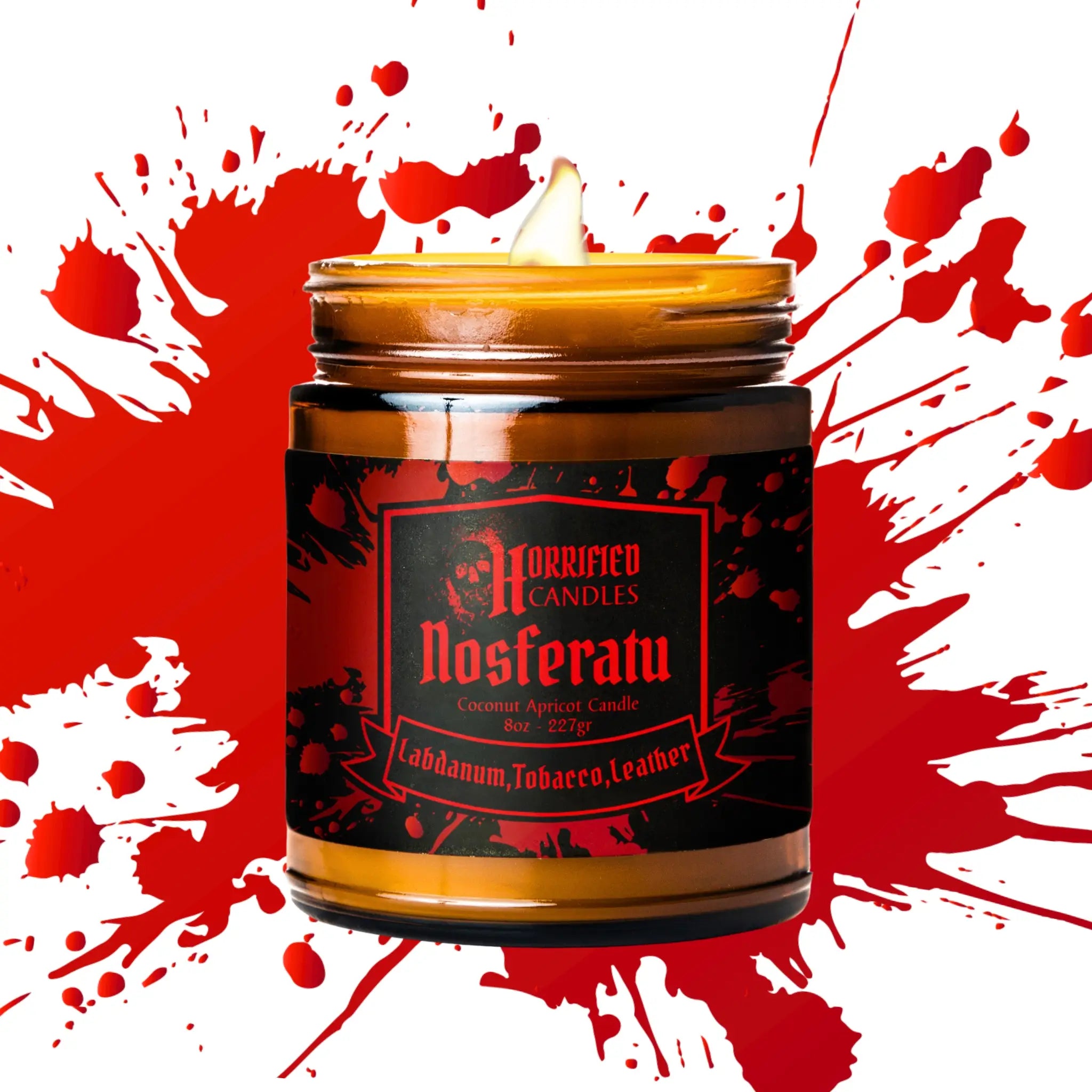Candle in a jar labeled 'Nosferatu' with a red and white splatter background
