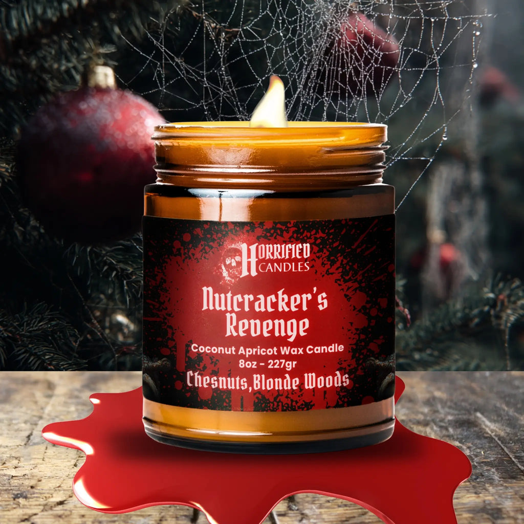 Candle labeled 'Nutcracker's Revenge' from Horrified Candles with a dark, Halloween-themed background.
