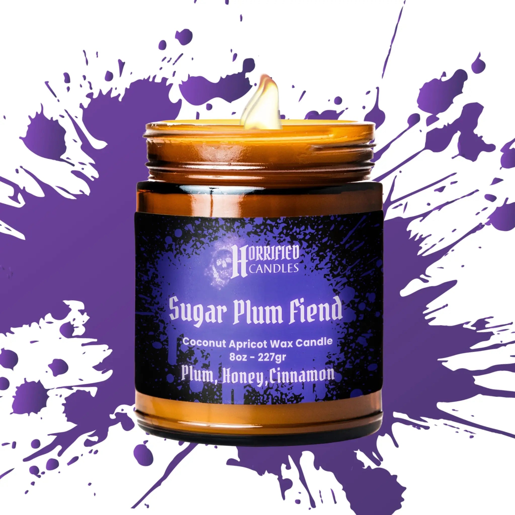 Candle jar labeled 'Sugar Plum Fiend' by Horrified Candles on a purple and white splatter background.