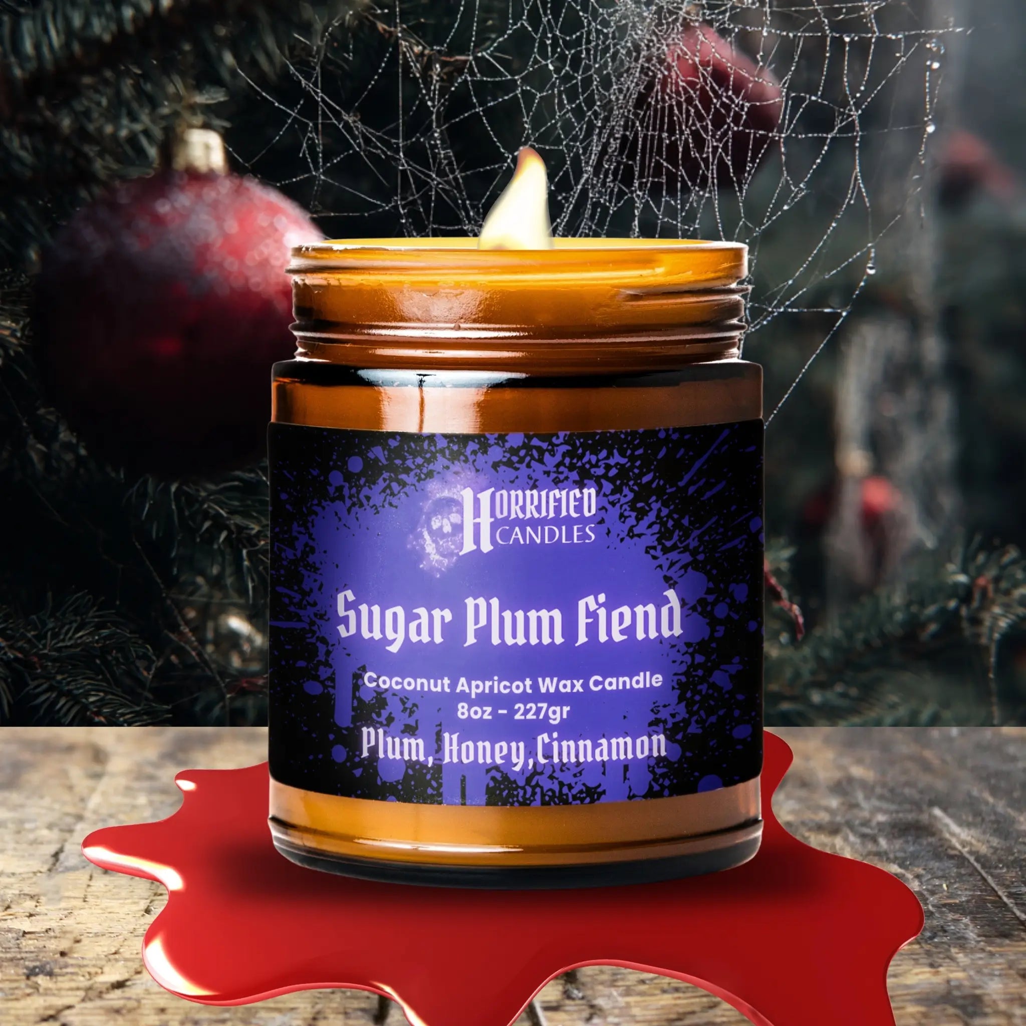 Candle labeled 'Sugar Plum Fiend' by Horrified Candles with a dark background.