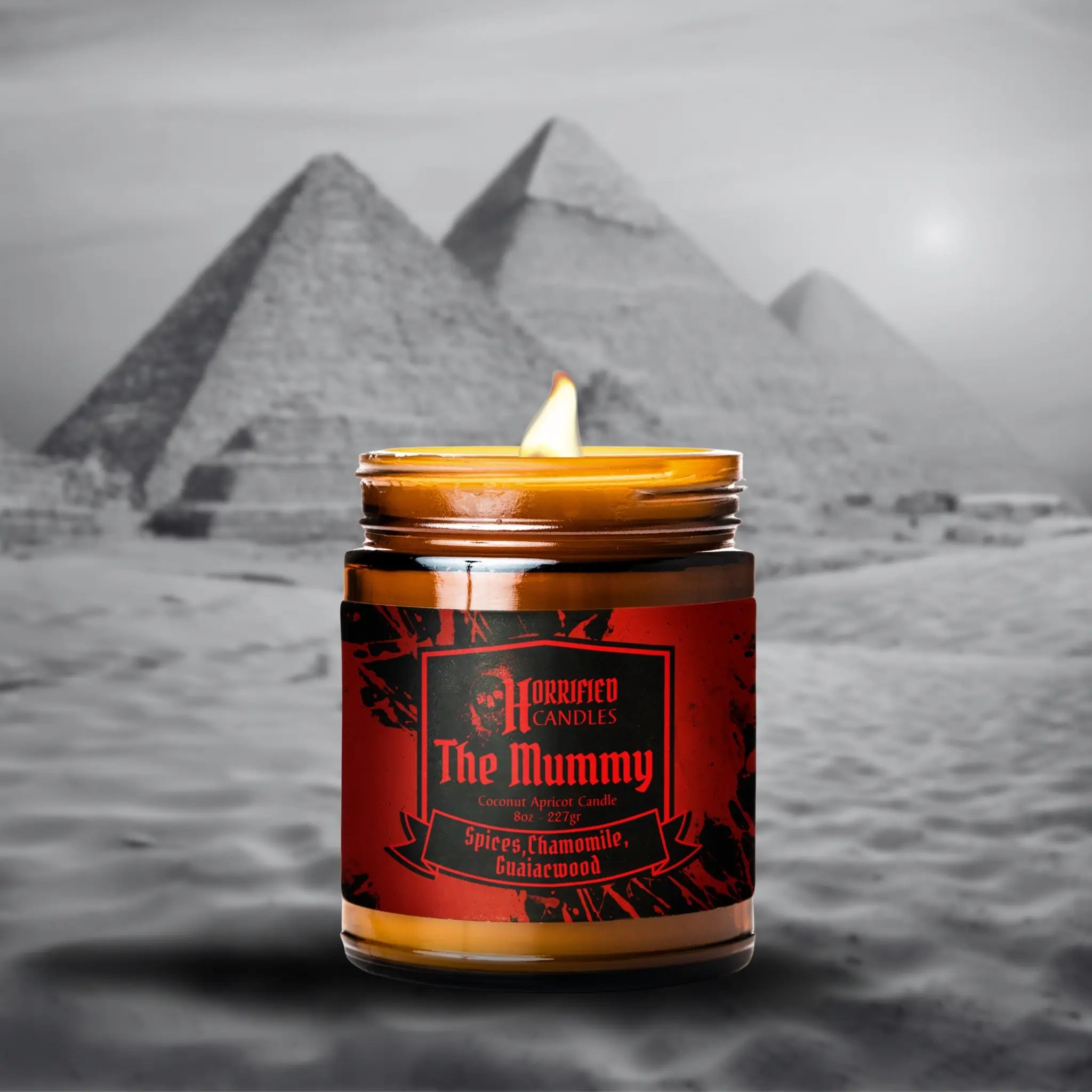 Candle labeled 'The Mummy' with pyramids in the background