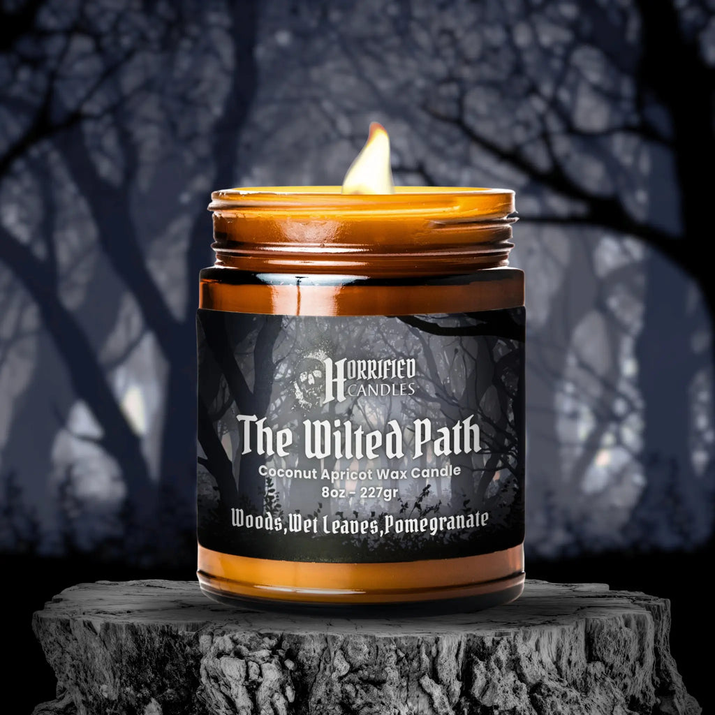 Candle labeled 'The Wilted Path' on a dark background with tree silhouettes.
