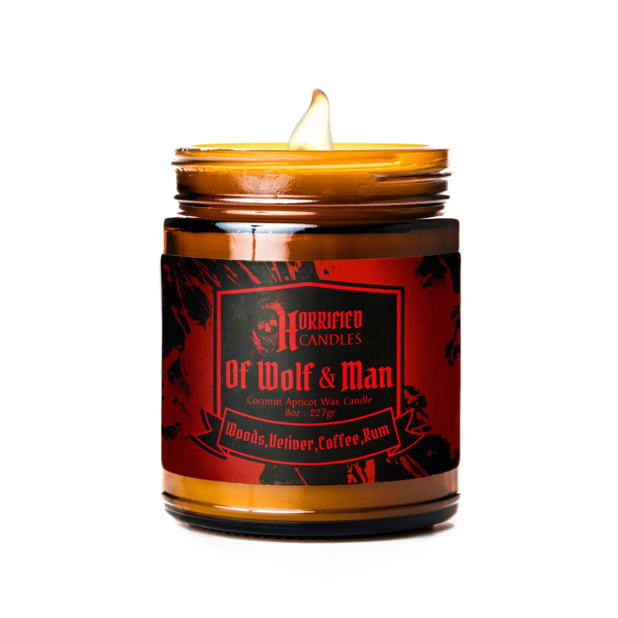 Candle in a glass jar with a red label on a white background